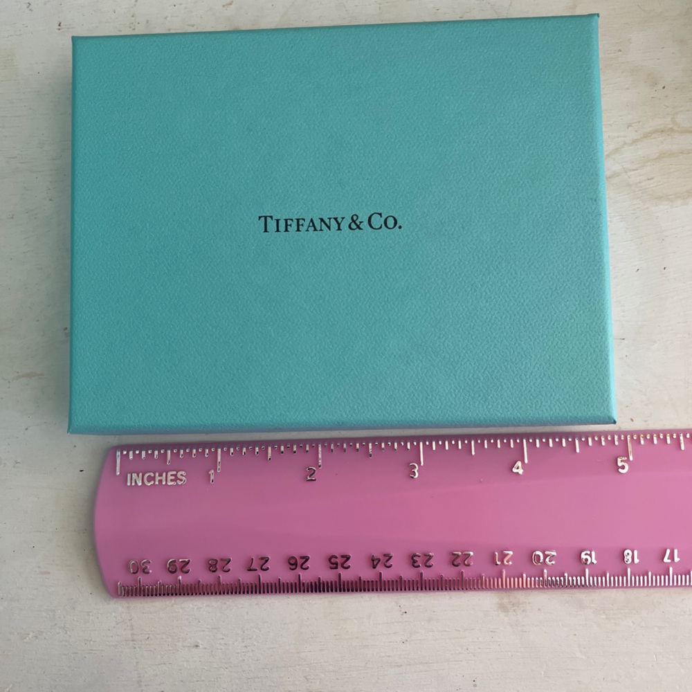 Authentic empty Tiffany & Co turquoise box with tissue paper